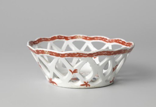 Bowl with quails near flowering plants