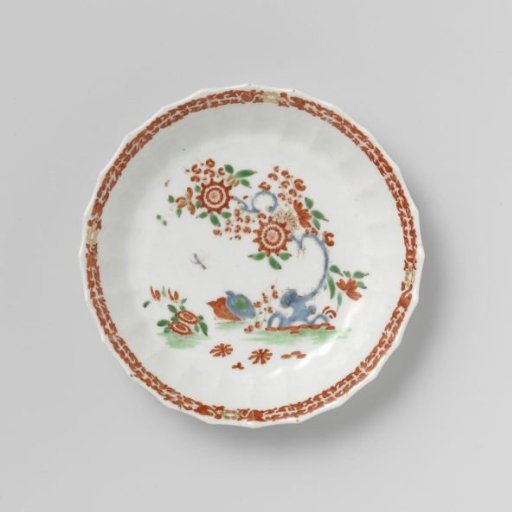 Saucer with quails near flowering plants