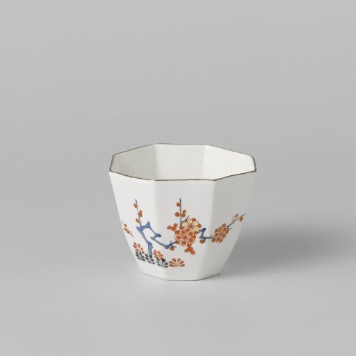 Cup with quail and flowering plants
