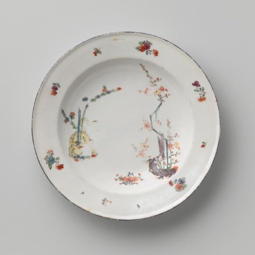 Plate with a tiger near flowering plants