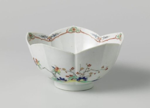 Bowl with flowering plants and flower sprays