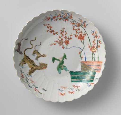Saucer-dish with bamboo, prunus, tiger and a Chinese boy