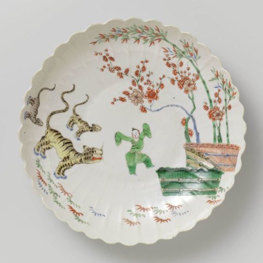 Saucer-dish with bamboo, prunus, tiger and a Chinese boy