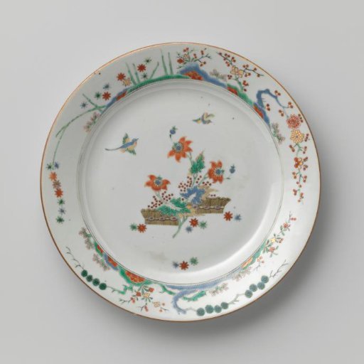Plate with flowering plants and birds