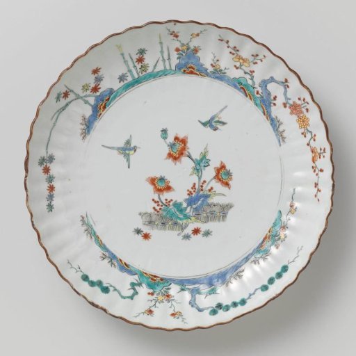 Fluted saucer-dish with birds, flowering plants and brushwood fences