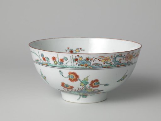 Bowl with flowering plants and birds