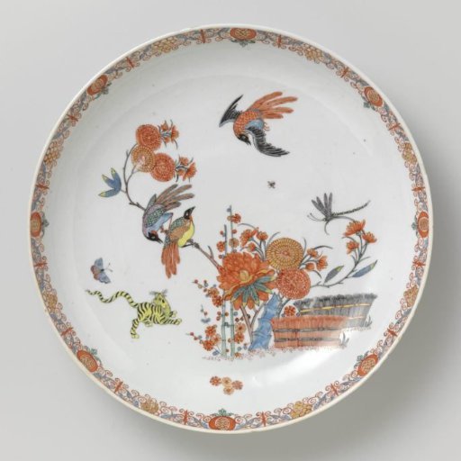 Saucer-dish with a tiger and birds near flowering plants and brushwood fences