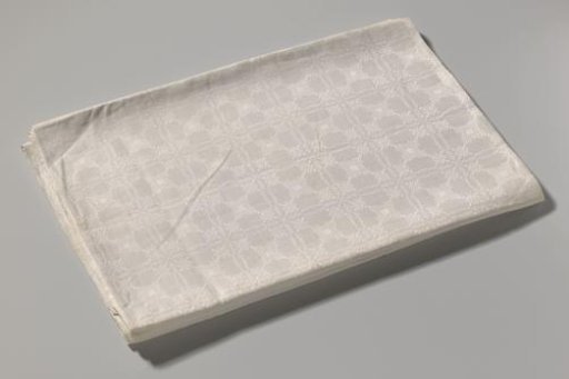 Tablecloth of white linen damask with pelican pattern