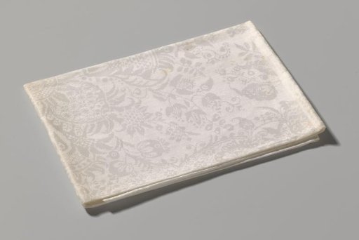 Linen damask napkin with a floral and lace pattern