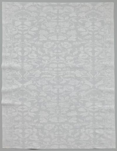 Napkin with pattern of scattered flowers and fruits