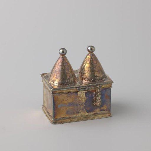 Chrismatorium in the form of a rectangular drum with two conical domes on the lid.
