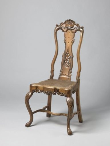 Chair with rattan seat. Canopy with crest between S-shaped volutes and leafwork, at the bottom three arches with rocaille motif