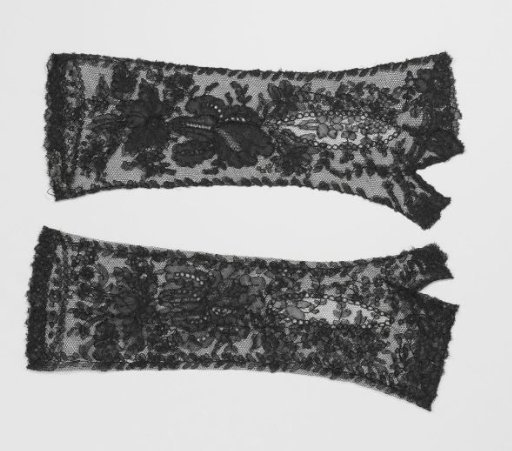 Mitten of black bobbin lace with iris, hanging clusters of flowers and bellflowers