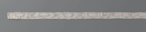 Insert of bobbin lace with flower between elongated volute leaves