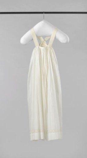 Long skirt of thin white cotton, ornamented at the hem with a border of English embroidery.