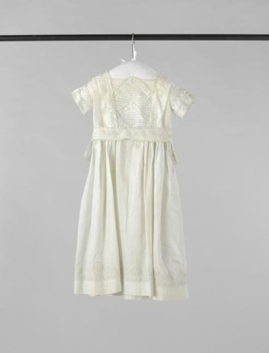 Children's dress of white linen with soutache and inserts, with sash