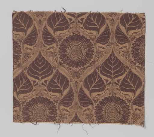Fragment of woven fabric with a pattern of sunflowers and butterflies within pointed ovals