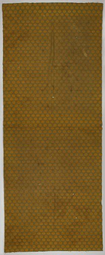Curtain fabric with a pattern of small leaves within pointed ovals