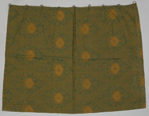 Curtain with pattern of flowers within broad pointed oval bands