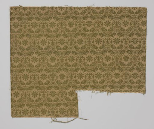 Fragment of upholstery fabric with a flower within a pointed oval