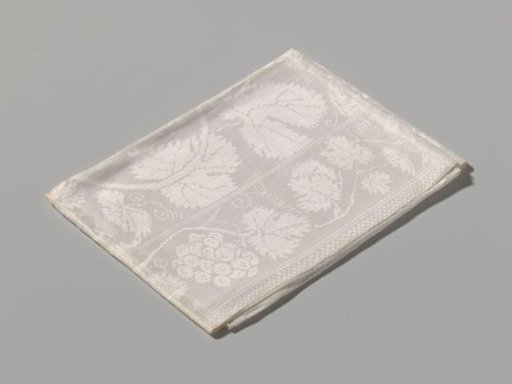 Linen napkin with grapevines and the arms of Nassau, Schagen, Hornes and Ghiennes. Marked AVB 13.