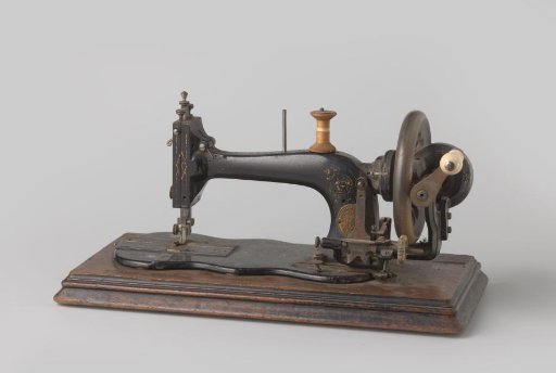Sewing machine of lacquered steel, inlaid with mother-of-pearl and provided with a ceramic handle, on a wooden base plate