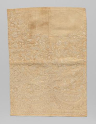 Embroidery in ecru on a fabric of the same colour