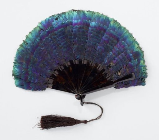 Folding fan with iridescent feathers of the pheasant on a mount of imitation tortoiseshell with silk cord and tassel