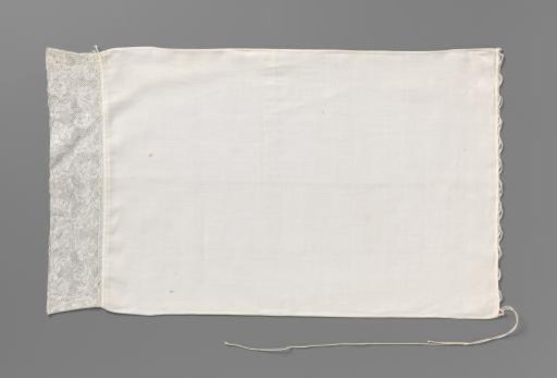 Demolition of linen with Binche lace; the lace pattern shows a running border with volutes, hanging tulips and standing composite flowers