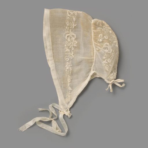 Child's Cap of Batiste with Plumetis Embroidery; on the wide brim is a narrow border of three openwork fils tirés leaves, between which fine vine work is applied