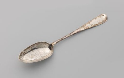 Spoon with engraved text on the underside of the bowl