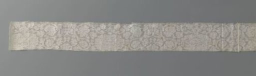 Strip of bobbin lace with large and small peonies on S-scroll vines