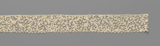Strip of needle lace with vertical scrolls