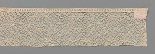 Strip of bobbin lace with a medley of motifs