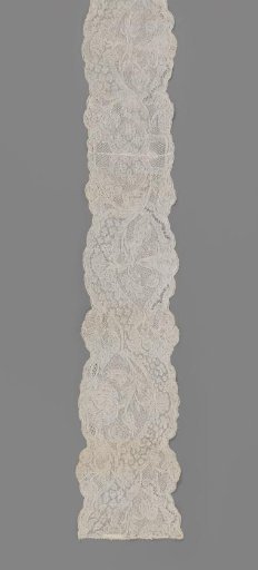 Two sewn-together caplets of Binche lace
