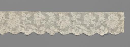 Border of bobbin lace with regularly wavy vine with peonies