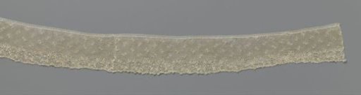 Strip of needle lace with interlocking arches