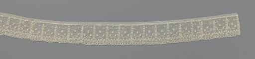 Strip of needle lace with double vertical spirals