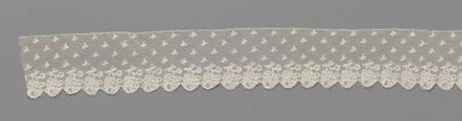 Strip of bobbin lace with hanging roses