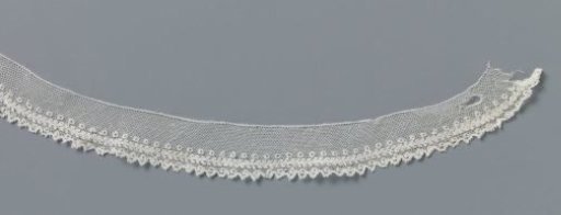 Strip of bobbin lace with three lengthwise stripes