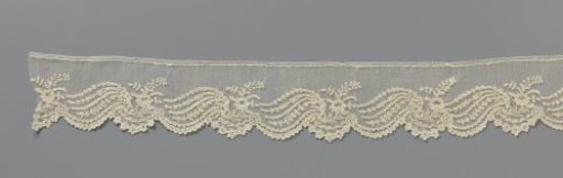 Strip of needle lace with rose branch and four leaf garlands