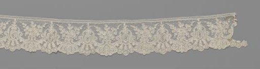 Strip of needle lace with hanging bells between C-scrolls