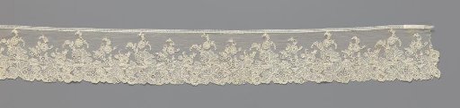 Strip of needle lace with large leaves and small flowers
