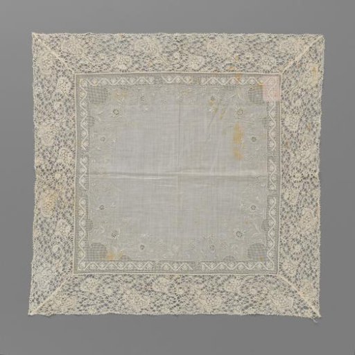 Handkerchief of batiste with white work continuing into a border of lace embroidery with a zigzag pattern and around a border of bobbin lace