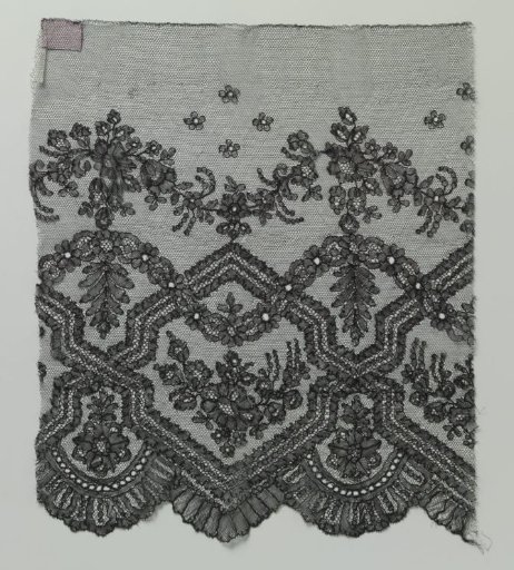 Strip of bobbin lace with rose branch in hexagon and two wavy flower garlands