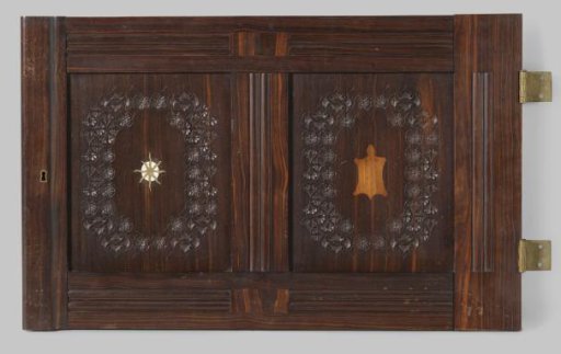 Door, part of a paneling from the house of Dentz van Schaick, carved and inlaid stylized floral and leaf motifs and animal and figurative representations