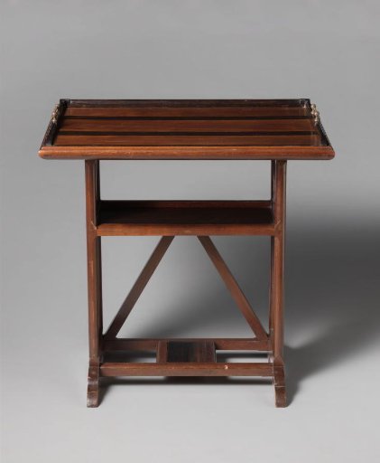 Tea table with removable serving tray and openwork side panels in a bean motif