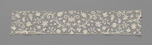 Strip of needle lace with circular petals and symmetrical vine pattern