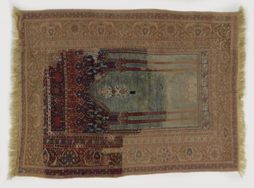 Prayer carpet with a blue mihrab supported by double red columns in the central field