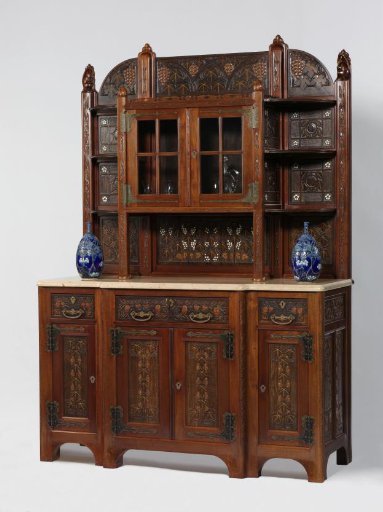 Buffet cabinet consisting of a lower and upper cabinet inlaid with ivory and wood carving depicting grapevines and bunches
